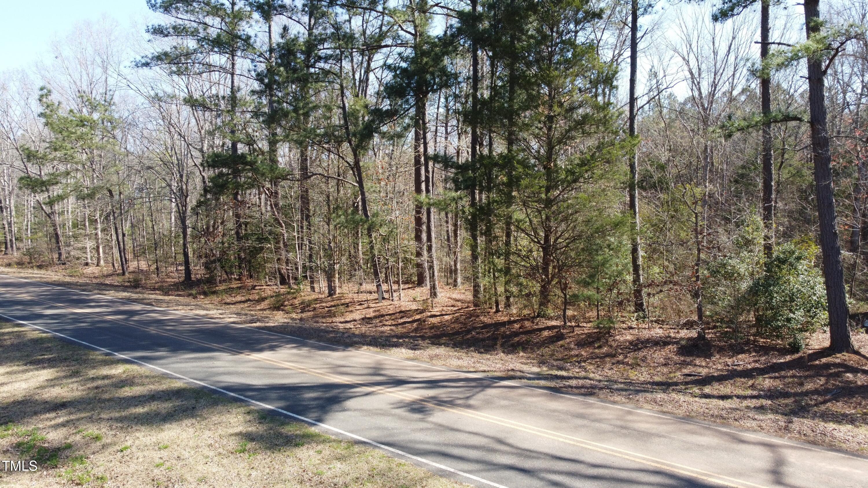 0 Reynolds Road Louisburg, NC 27549 - Photo 3 of 13 a view of a backyard with large trees