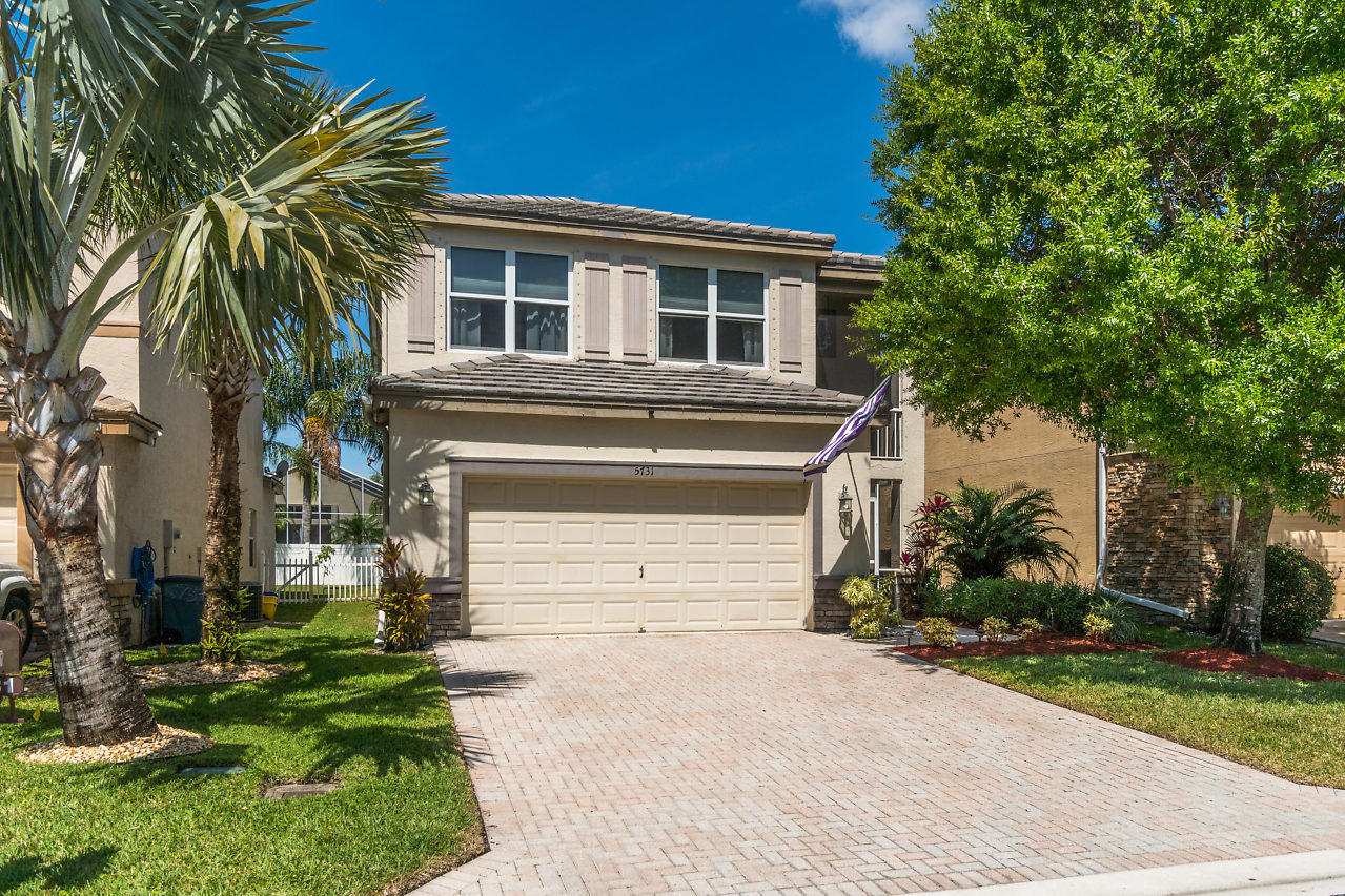 5731 Raceway Road Lake Worth, FL 33449 - Photo 1 of 43 a front view of a house with a yard