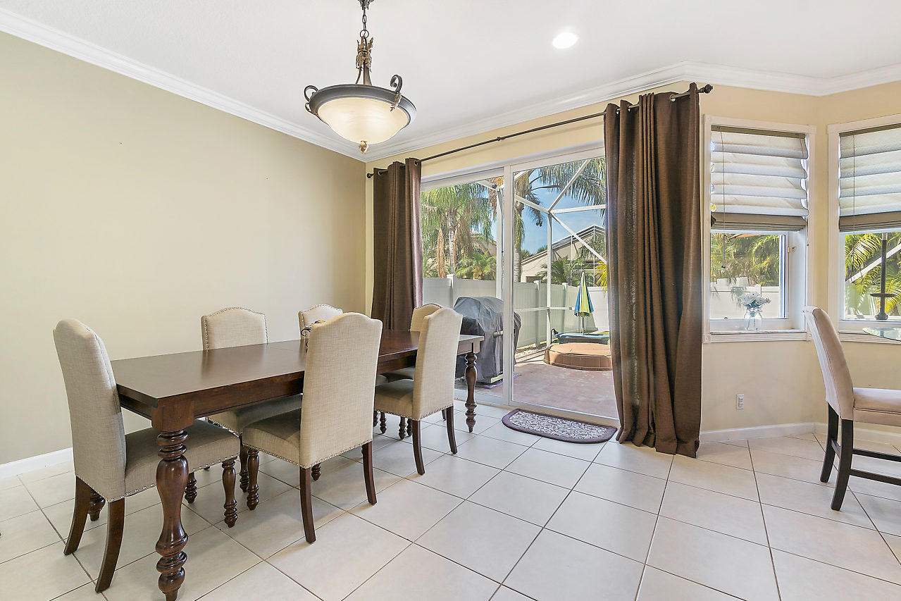 5731 Raceway Road Lake Worth, FL 33449 - Photo 13 of 43 a view of a dining room with furniture window and outside view