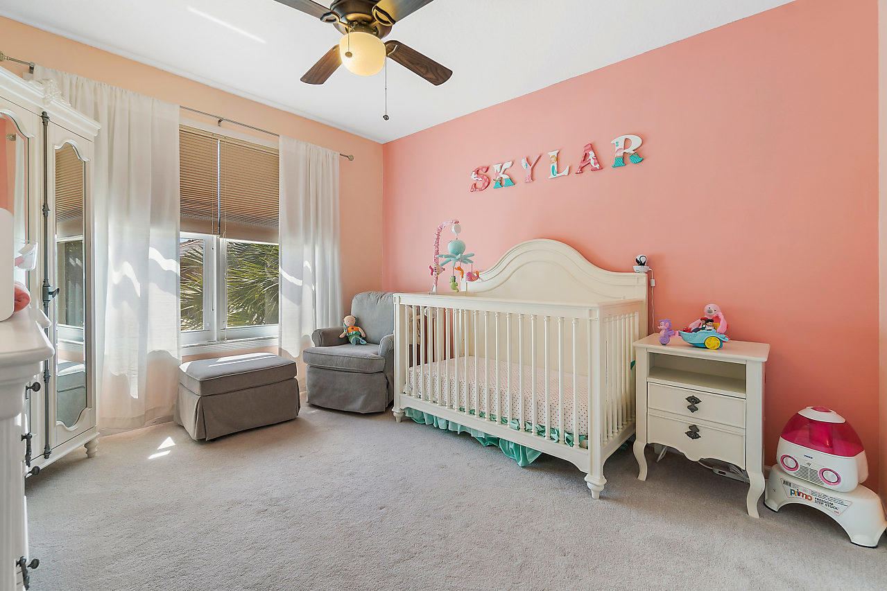 5731 Raceway Road Lake Worth, FL 33449 - Photo 18 of 43 a bedroom with furniture and a window