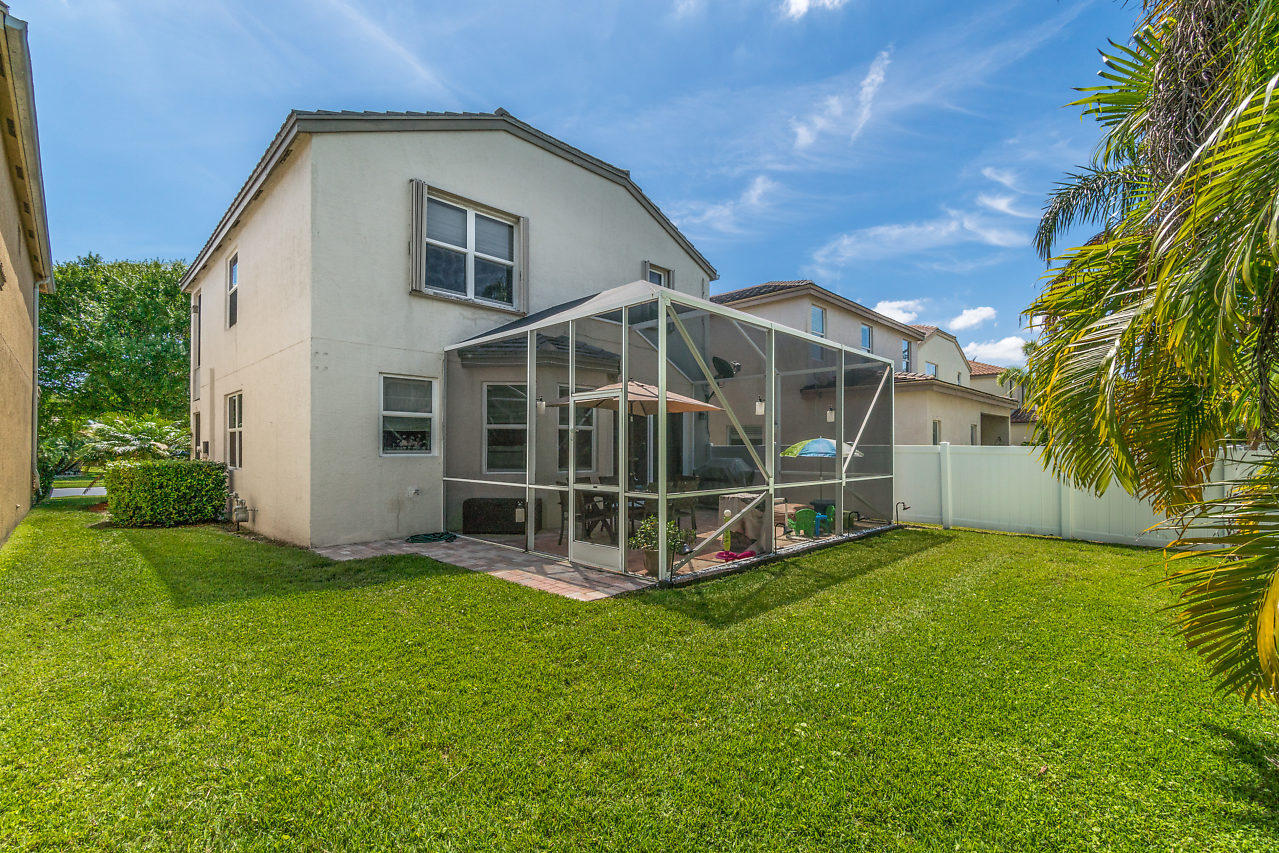 5731 Raceway Road Lake Worth, FL 33449 - Photo 25 of 43 a view of a house with a yard