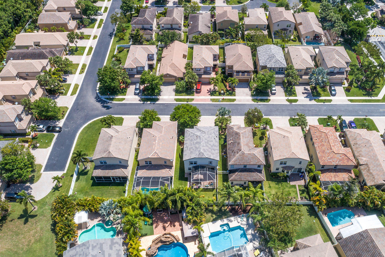 5731 Raceway Road Lake Worth, FL 33449 - Photo 30 of 43 an aerial view of a multi story residential apartment building with yard and outdoor seating