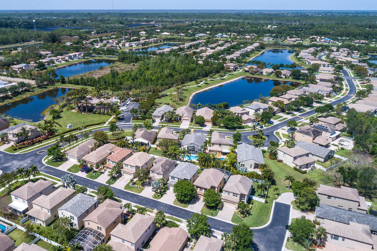 5731 Raceway Road Lake Worth, FL 33449 - Photo 33 of 43 an aerial view of residential houses with outdoor space