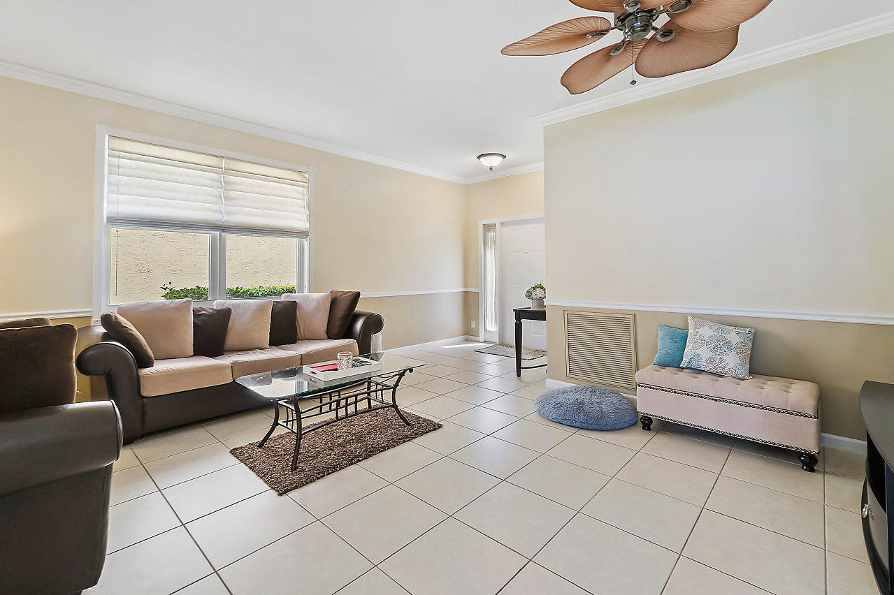 5731 Raceway Road Lake Worth, FL 33449 - Photo 5 of 43 a living room with furniture and a window