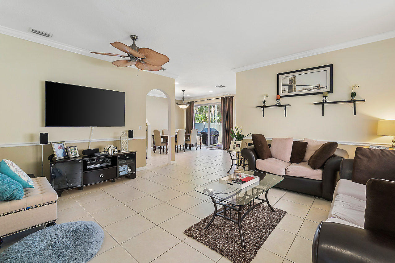 5731 Raceway Road Lake Worth, FL 33449 - Photo 6 of 43 a living room with furniture and a flat screen tv