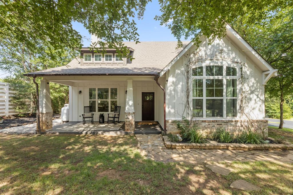 665 Chinn Chapel Road Copper Canyon, TX 75077 - Photo 1 of 26 a front view of a house with a garden and patio
