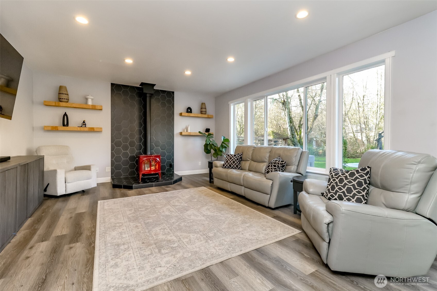 30904 37th Avenue East Graham, WA 98338 - Photo 12 of 40 a living room with furniture and a flat screen tv