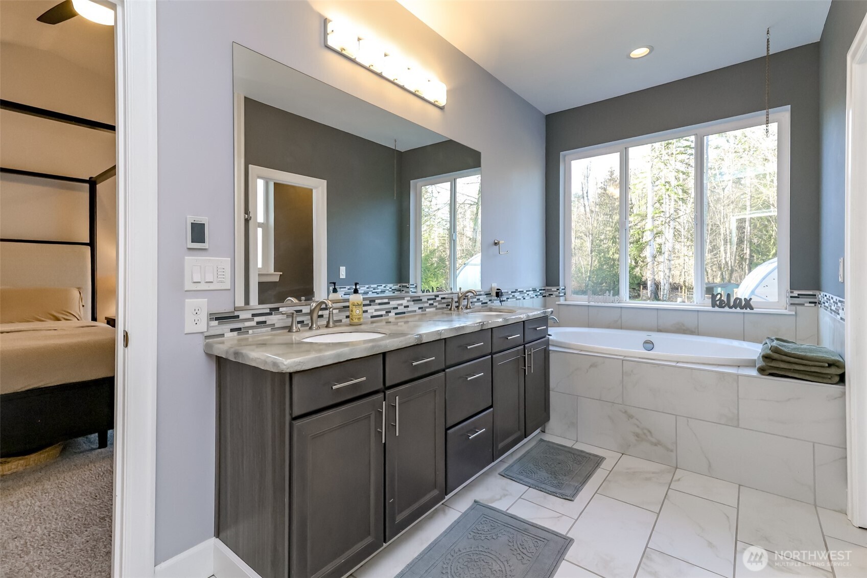 30904 37th Avenue East Graham, WA 98338 - Photo 16 of 40 a bathroom with a sink and a bathtub