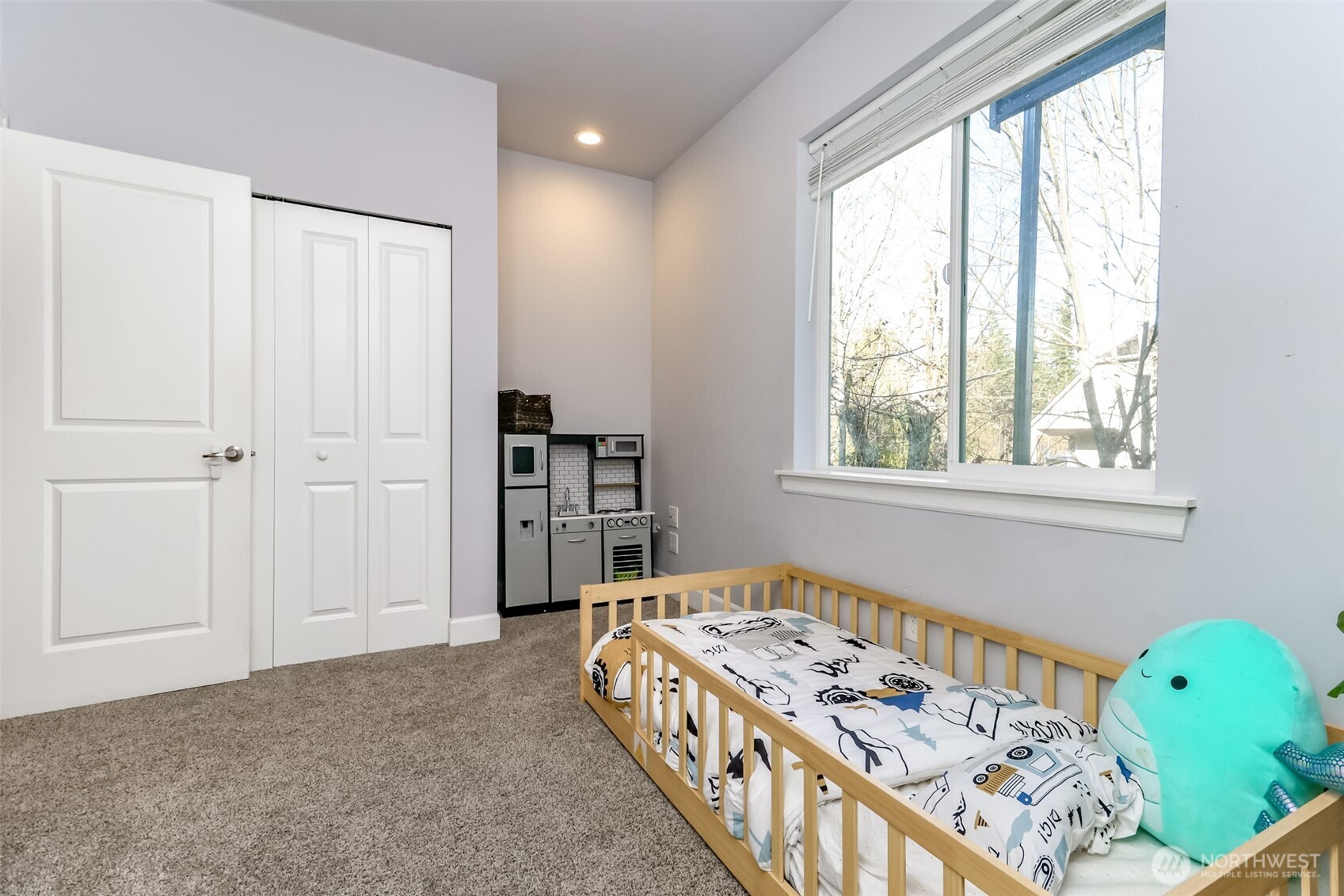 30904 37th Avenue East Graham, WA 98338 - Photo 18 of 40 a bedroom with a bed and a window