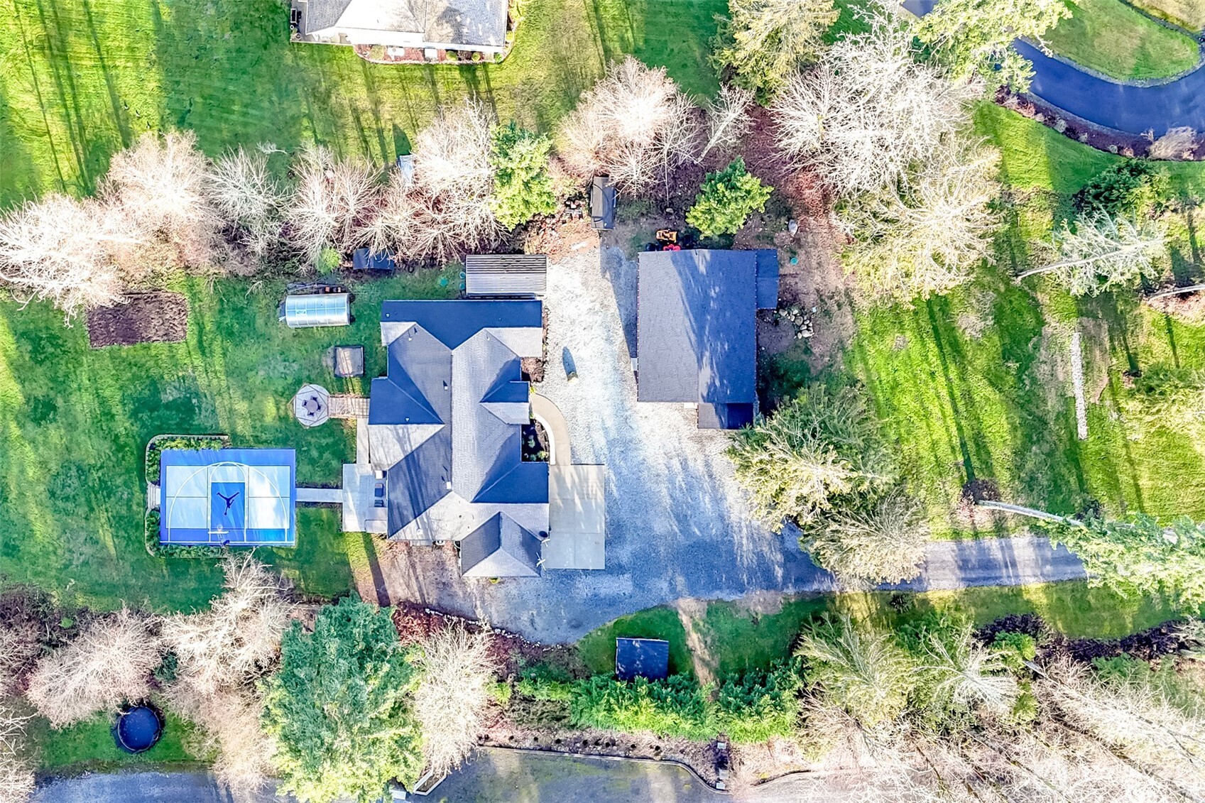30904 37th Avenue East Graham, WA 98338 - Photo 37 of 40 a view of a house with a yard and garden