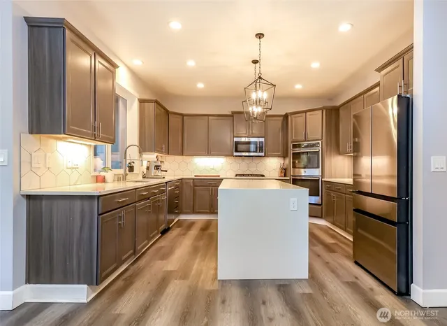 a dining room with furniture window and wooden floor