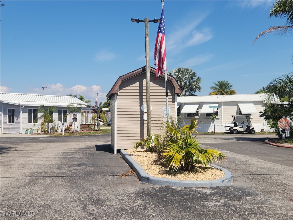 1159 Daniels Road, Unit 74 Moore Haven, FL 33471 - Photo 14 of 37 a view of a porch with a table and chairs
