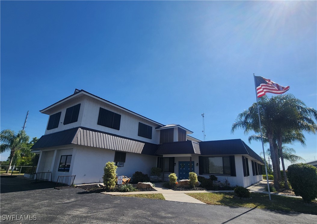 1159 Daniels Road, Unit 74 Moore Haven, FL 33471 - Photo 15 of 37 a front view of a house with garden