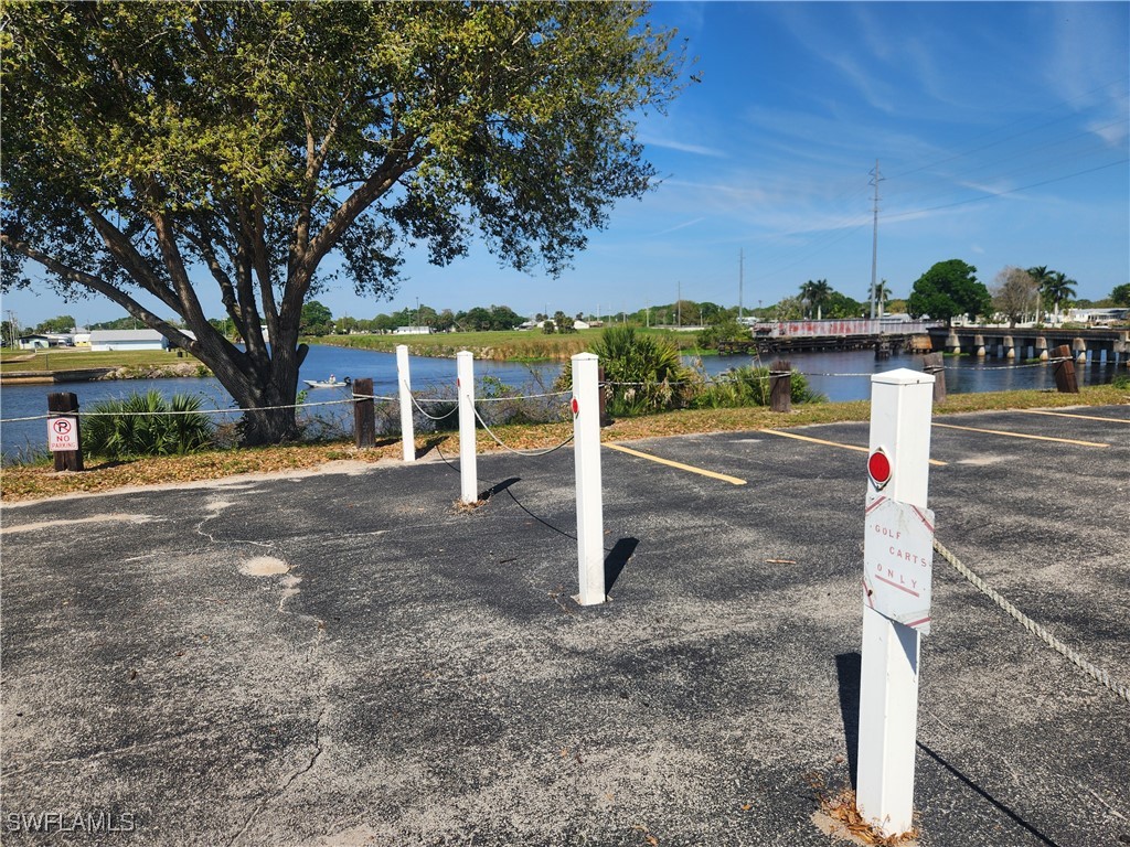 1159 Daniels Road, Unit 74 Moore Haven, FL 33471 - Photo 16 of 37 a front view of a house with a yard