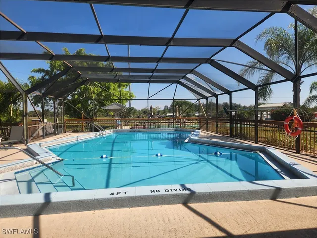 a view of a swimming pool with a patio