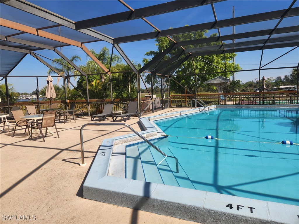 1159 Daniels Road, Unit 74 Moore Haven, FL 33471 - Photo 18 of 37 a view of a swimming pool with a patio