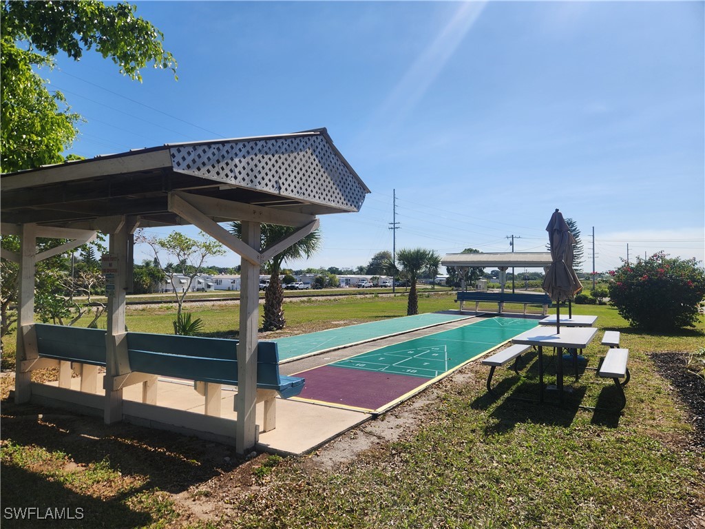 1159 Daniels Road, Unit 74 Moore Haven, FL 33471 - Photo 26 of 37 a view of a swimming pool with a patio