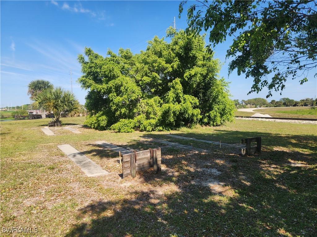 1159 Daniels Road, Unit 74 Moore Haven, FL 33471 - Photo 27 of 37 a view of a yard with an outdoor space