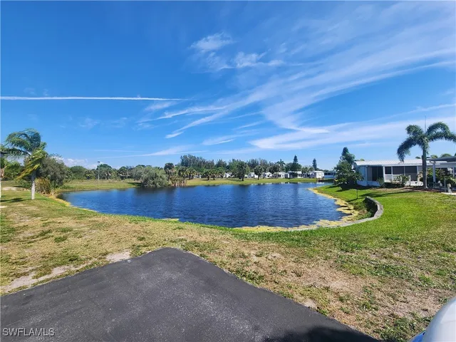 a view of a house with backyard porch and furniture