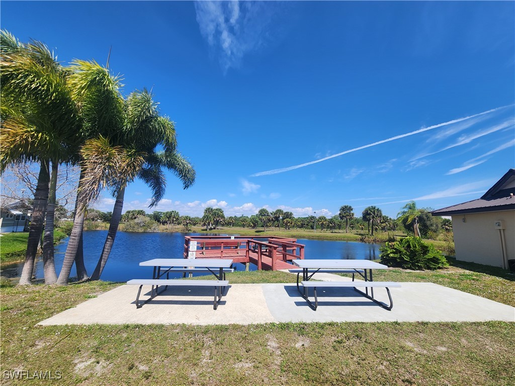 1159 Daniels Road, Unit 74 Moore Haven, FL 33471 - Photo 33 of 37 a view of a swimming pool with lounge chairs