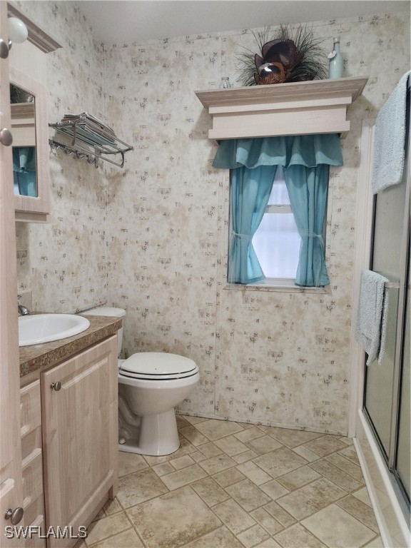 1159 Daniels Road, Unit 74 Moore Haven, FL 33471 - Photo 9 of 37 a bathroom with a toilet and a sink
