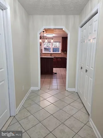 a view of a hallway and a livingroom with a furniture