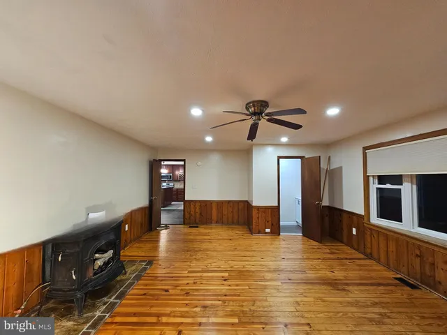 a view of a kitchen with a sink and a refrigerator