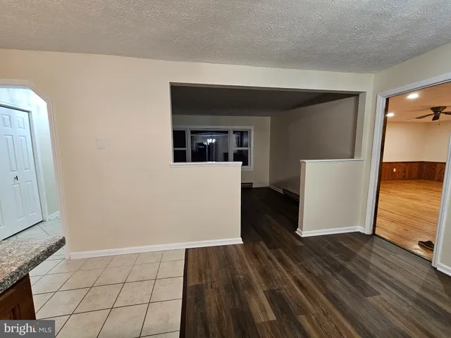 a view of a kitchen from the hallway