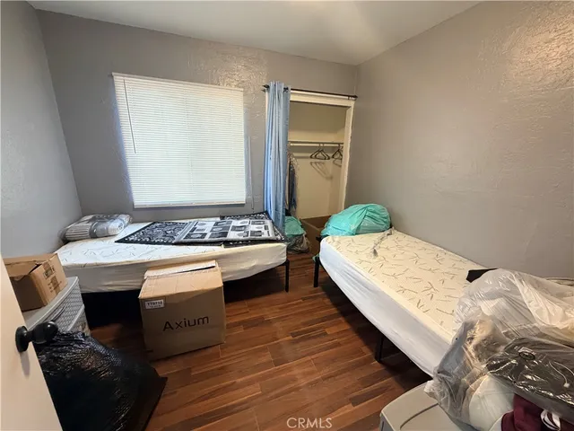 a bedroom with a bed and a table in it