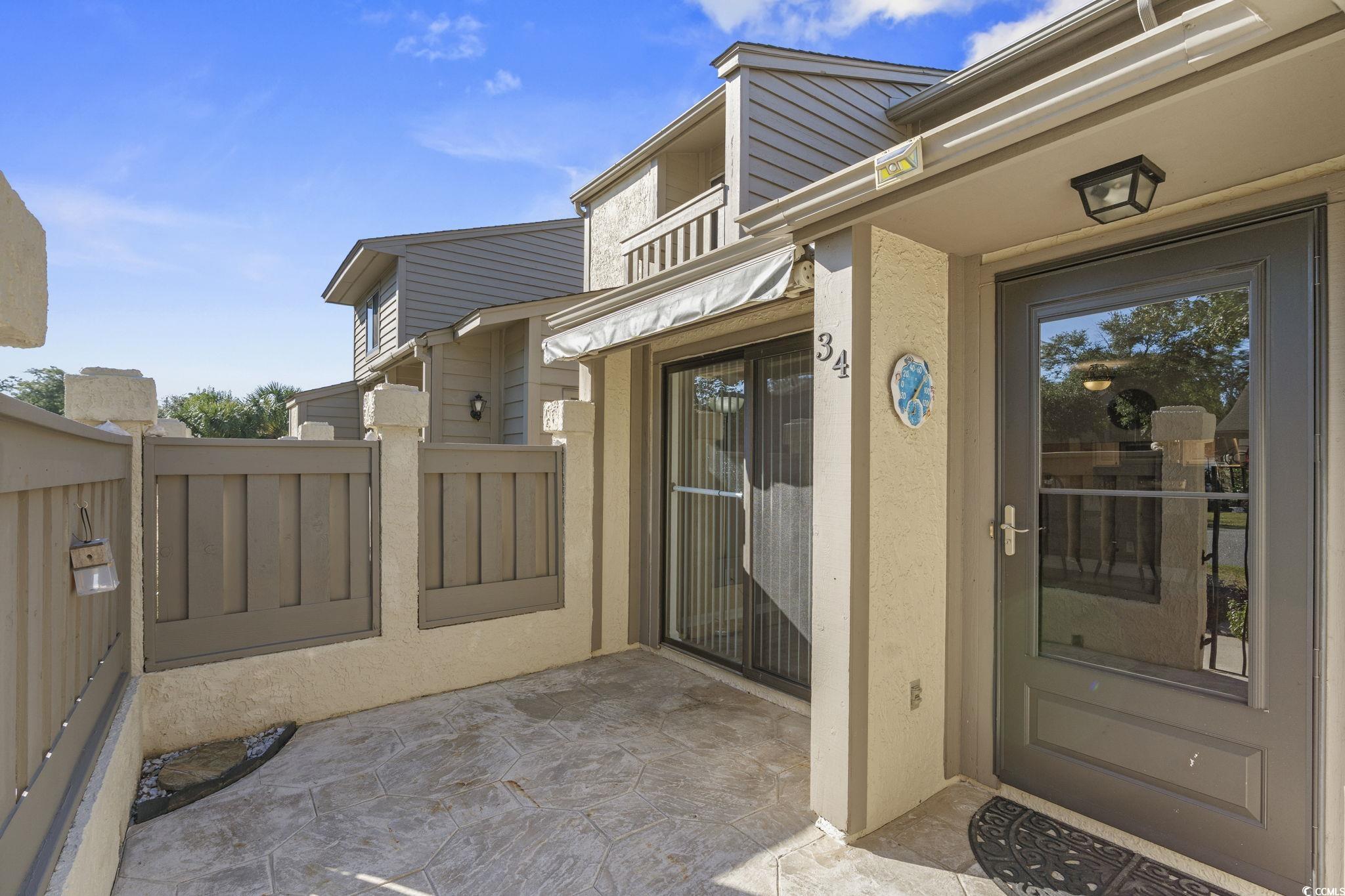 613 14th Avenue South, Unit 34 Surfside Beach, SC 29575 - Photo 23 of 37 Entrance to property featuring stucco siding