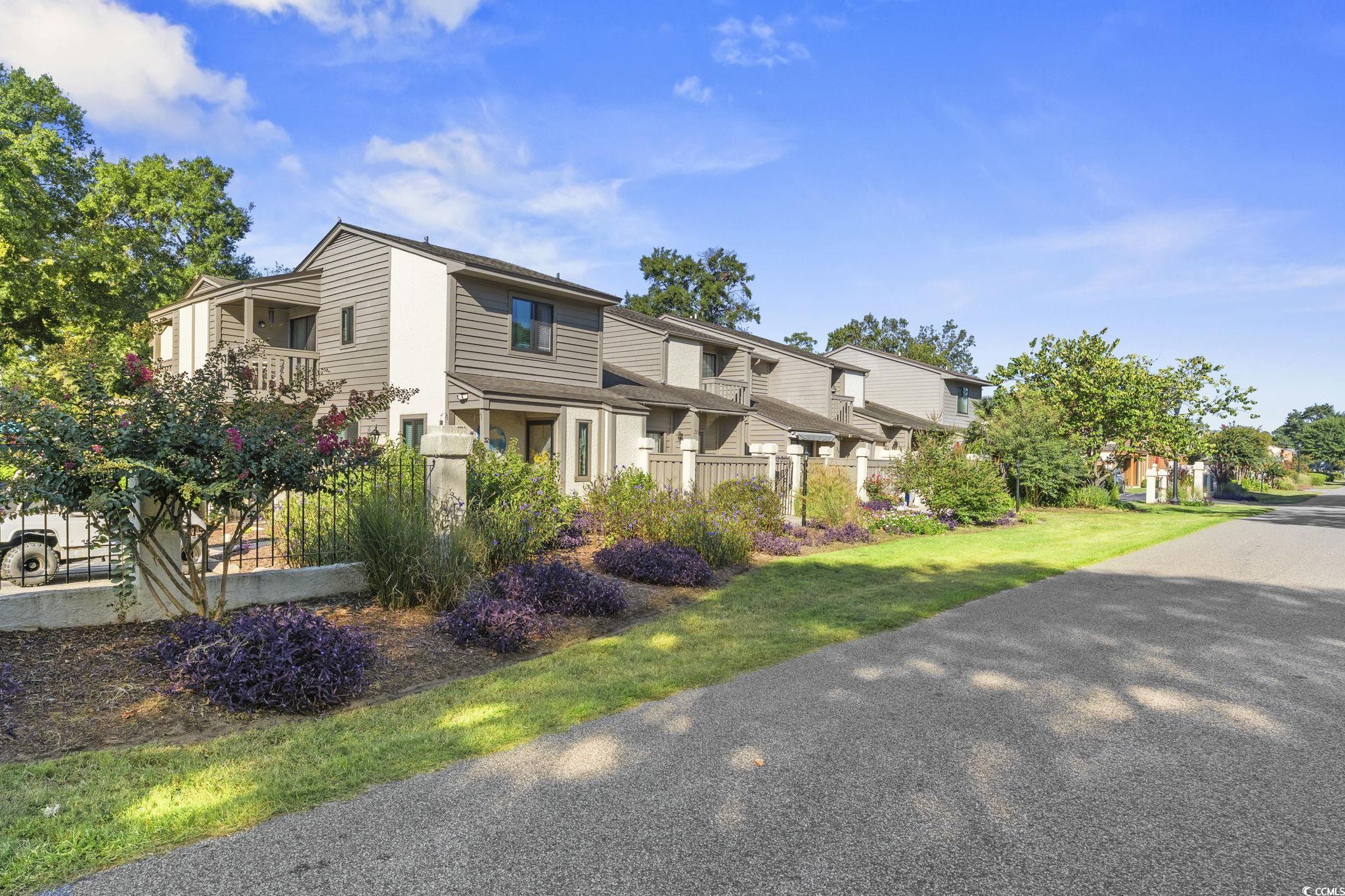 613 14th Avenue South, Unit 34 Surfside Beach, SC 29575 - Photo 24 of 37 View of front facade with a residential view