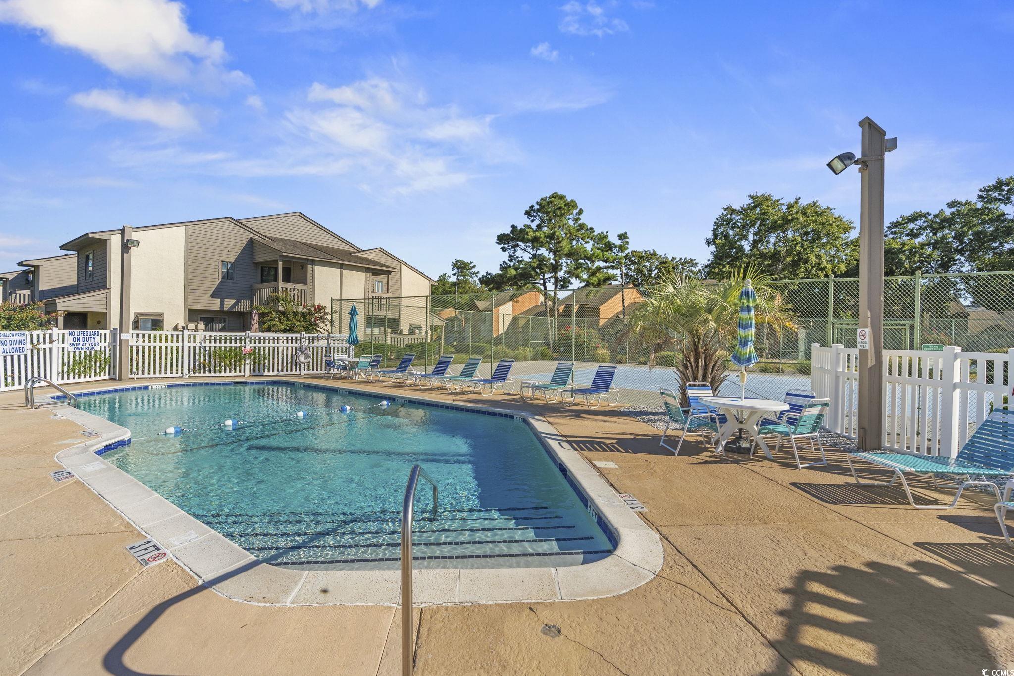 613 14th Avenue South, Unit 34 Surfside Beach, SC 29575 - Photo 26 of 37 Community pool with a patio area