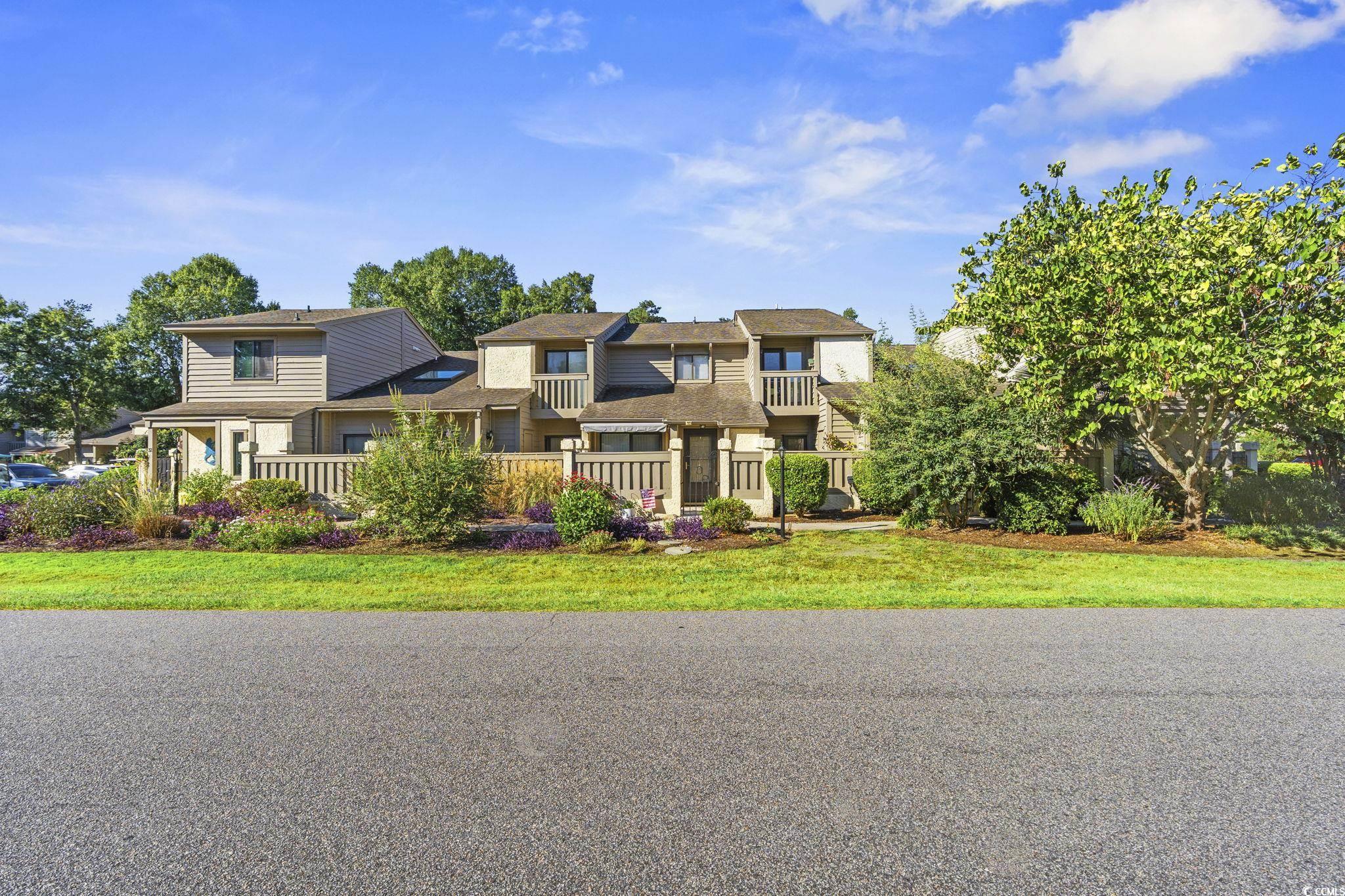 613 14th Avenue South, Unit 34 Surfside Beach, SC 29575 - Photo 28 of 37 View of front of home with a balcony and a front lawn