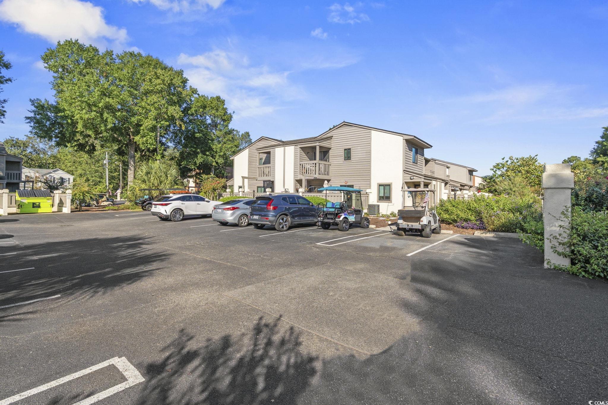 613 14th Avenue South, Unit 34 Surfside Beach, SC 29575 - Photo 3 of 37 View of uncovered parking lot