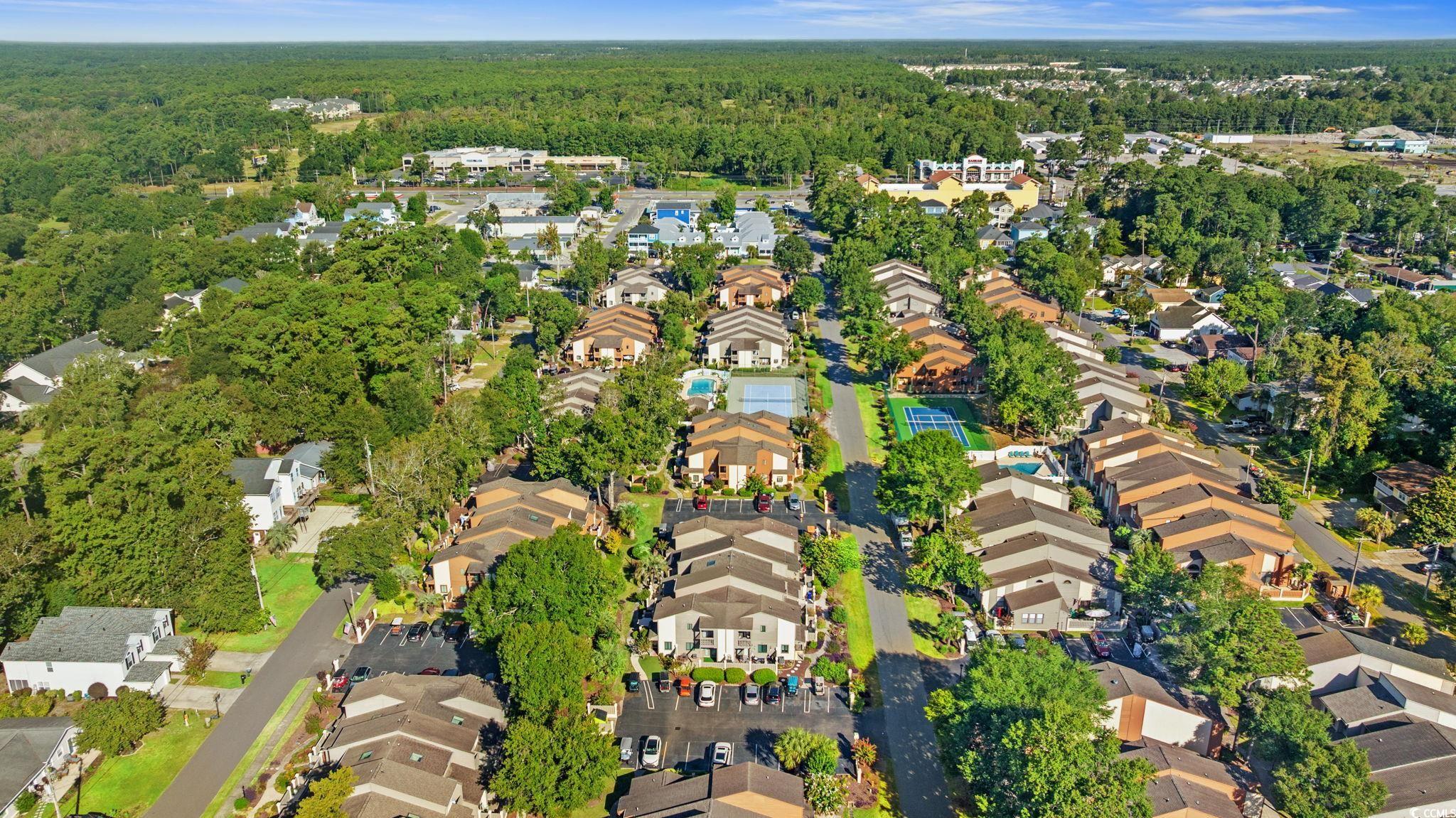 613 14th Avenue South, Unit 34 Surfside Beach, SC 29575 - Photo 33 of 37 Aerial view of property's location with nearby suburban area and a forest