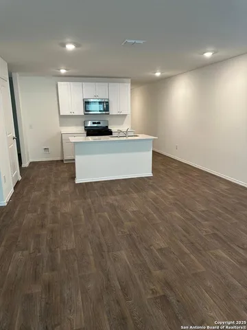 a bathroom with a sink a toilet and a shower