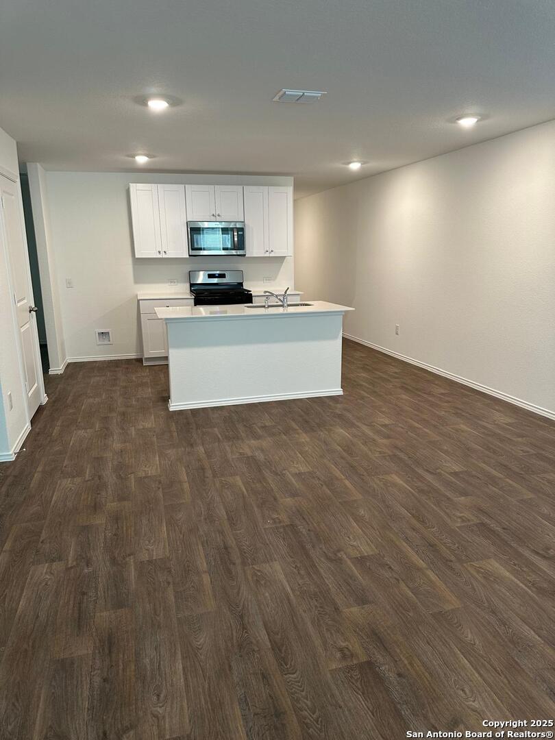 5032 Pitch Mark San Antonio, TX 78261 - Photo 11 of 21 a view of kitchen with microwave and cabinets
