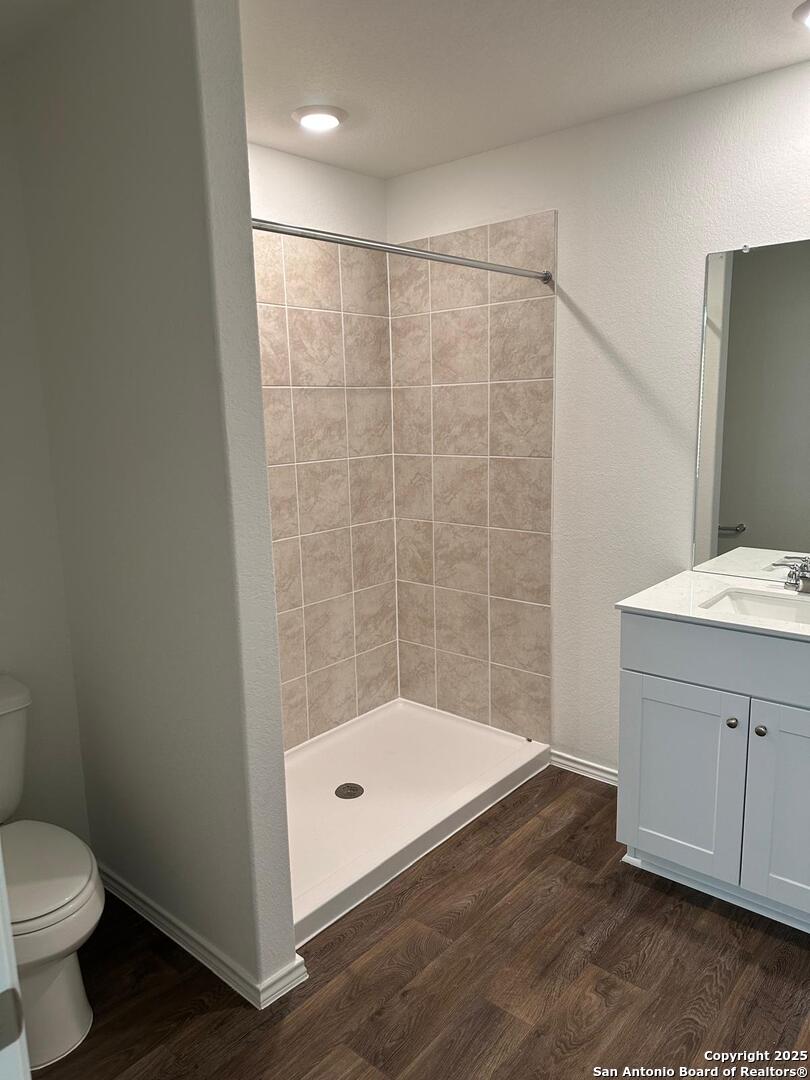 5032 Pitch Mark San Antonio, TX 78261 - Photo 12 of 21 a bathroom with a sink a toilet and a shower