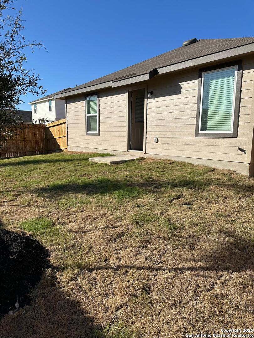 5032 Pitch Mark San Antonio, TX 78261 - Photo 17 of 21 a front view of a house with a yard