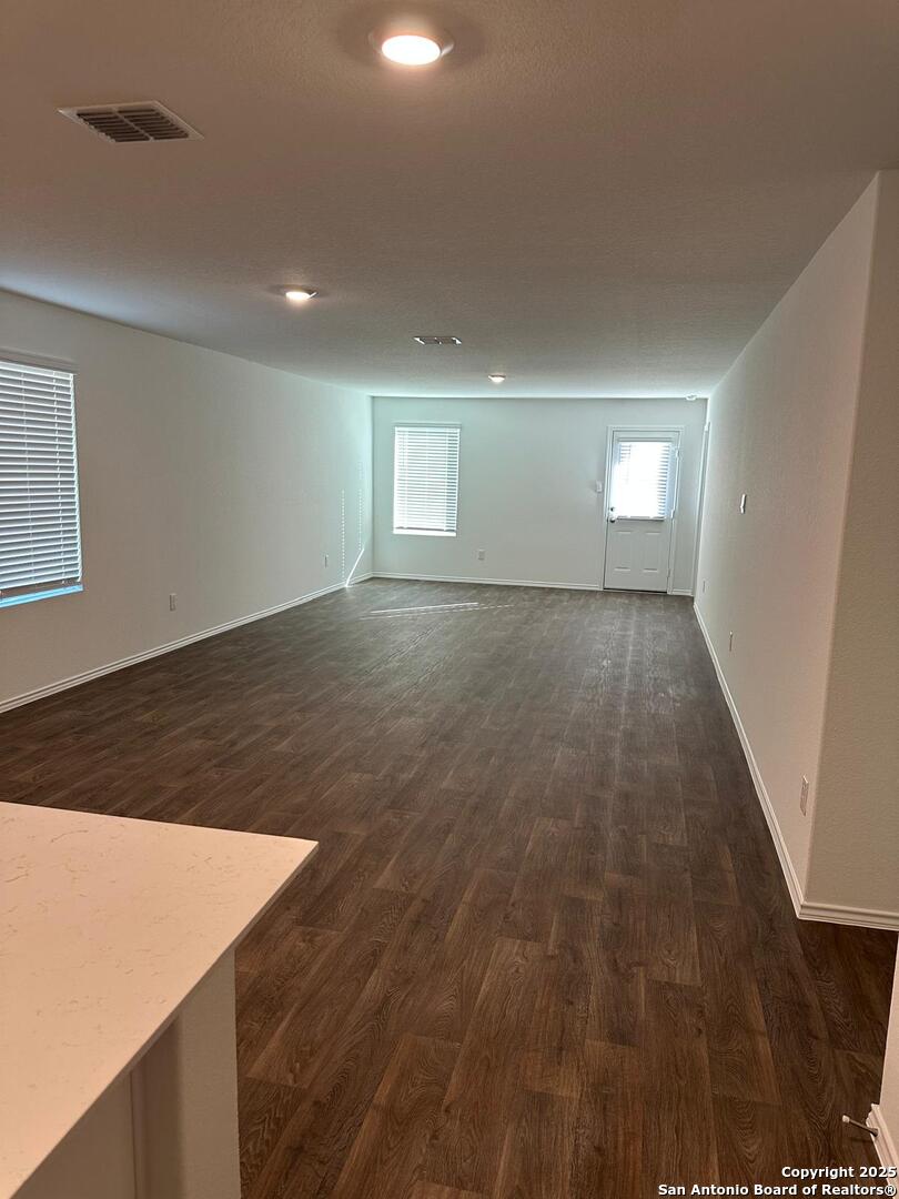 5032 Pitch Mark San Antonio, TX 78261 - Photo 9 of 21 an empty room with wooden floor