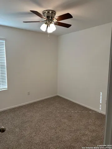 a view of kitchen with microwave and cabinets