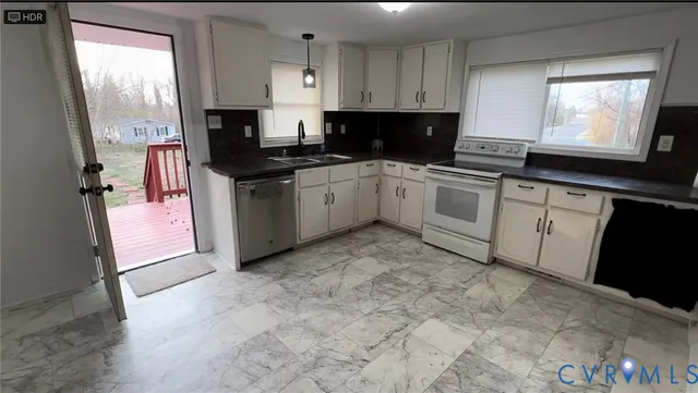 a kitchen with a sink cabinets and window