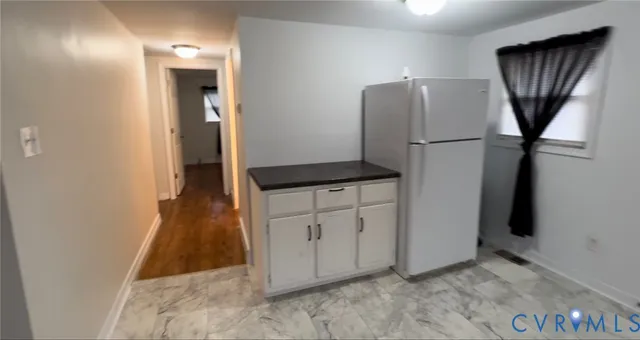 a view of hallway with cabinets