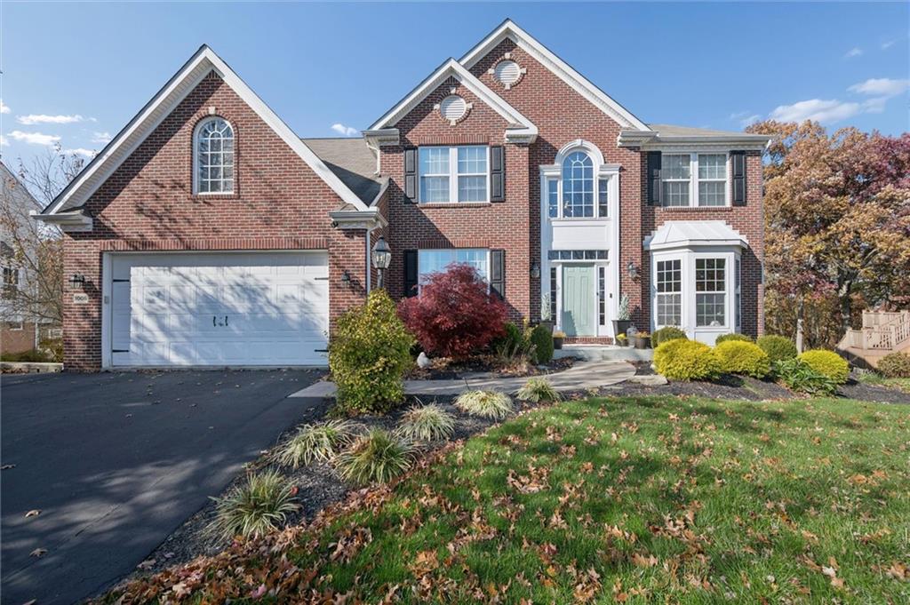 1005 Autumn Woods Drive Coraopolis, PA 15108 - Photo 1 of 50 a front view of a house with garden