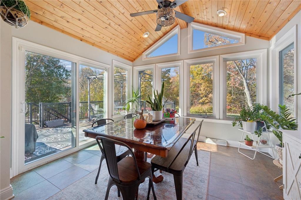 1005 Autumn Woods Drive Coraopolis, PA 15108 - Photo 16 of 50 a dining room with furniture large windows and wooden floor