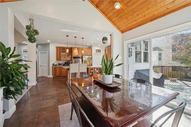 a view of an entryway wooden floor and chandelier