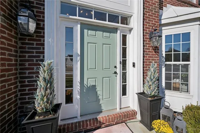 a front view of a house with a glass door