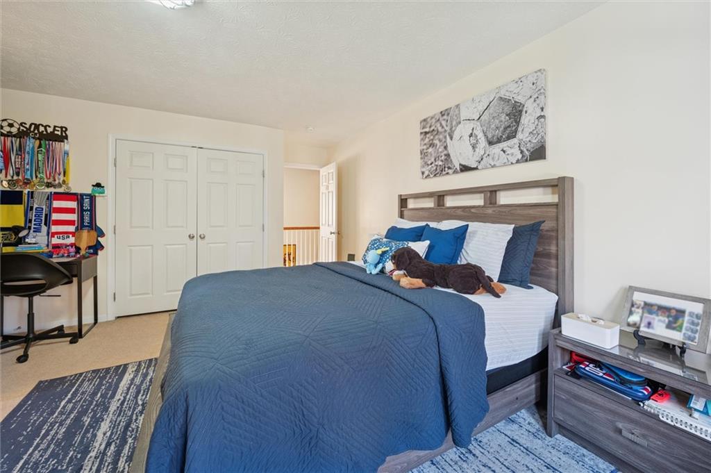 1005 Autumn Woods Drive Coraopolis, PA 15108 - Photo 35 of 50 a bed room with a bed and a tv