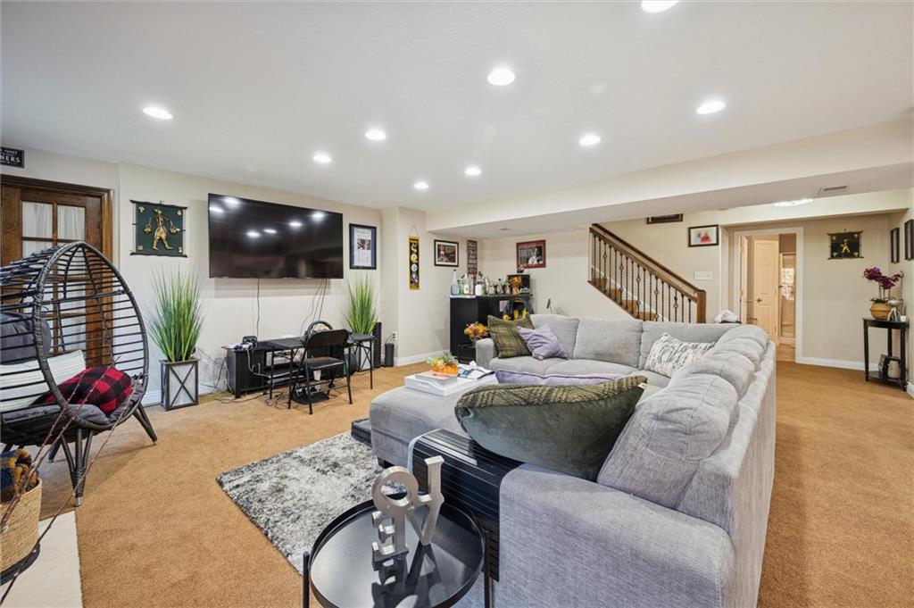 1005 Autumn Woods Drive Coraopolis, PA 15108 - Photo 41 of 50 a living room with furniture and a flat screen tv