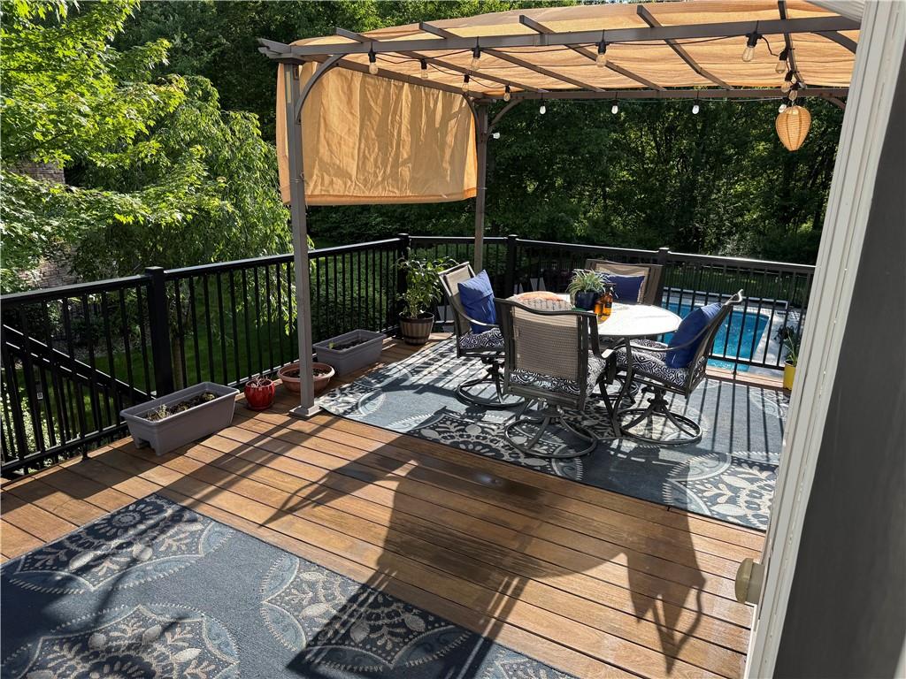 1005 Autumn Woods Drive Coraopolis, PA 15108 - Photo 48 of 50 a view of a patio with table and chairs with wooden floor